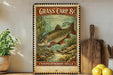 A vintage-style poster of a fish, likely a carp, is displayed on a wall next to a wooden cutting board and some kitchen utensils.