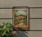 A postage stamp-like sign featuring a large fish, likely a gar, against a backdrop of underwater plants and coral.