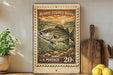 A vintage-style postage stamp featuring a striped bass, placed on a wooden surface next to a wooden cutting board and some lemons.