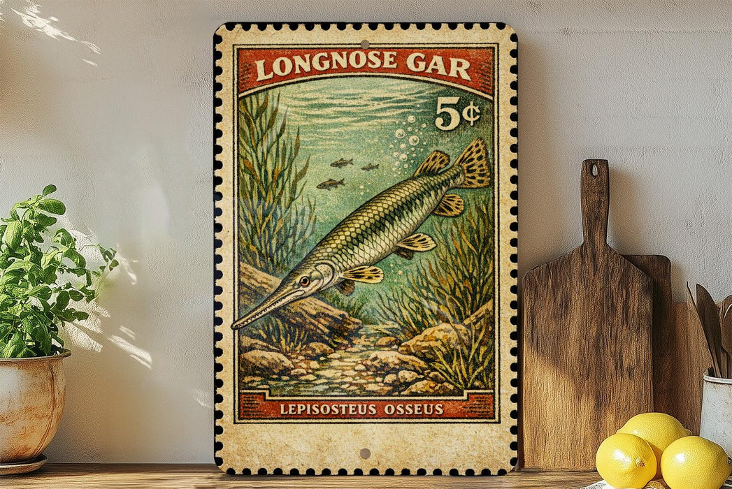 A vintage-style postage stamp featuring a fish, likely a lepsosteus, swimming in a green underwater scene. The stamp is displayed on a wall, with a wooden cutting board and a potted plant visible in the foreground.