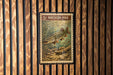 A postage stamp featuring a pike fish is displayed on a wooden wall.