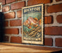 A vintage-style postage stamp featuring a colorful illustration of a rockfish, mounted on a brick wall.