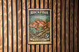 A vintage U.S. postage stamp featuring a colorful illustration of a rockfish, with the text "ROCKFISH (YELLOWEYE)" and "5¢" printed on it.