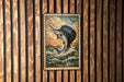 a framed painting of a blue marlin fish leaping out of the water, set against a wooden background.