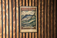 A vintage-style stamp featuring a tuna fish, with the text "SKIPJACK TUNA 10c" and "KATSWOONIS PEALAMIS" printed on it.