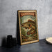 A metal sign with a fish illustration and the text "SNAKEHEAD 20¢" is displayed on a table.