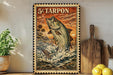 A framed vintage-style stamp depicting a fish jumping out of the water, with a tropical landscape in the background.