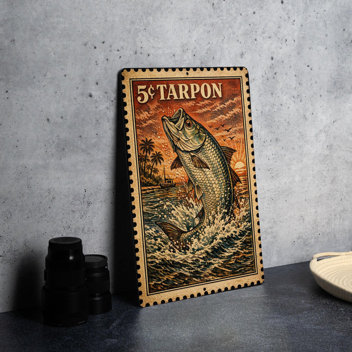 A framed poster of a fish jumping out of the water, with a 5¢ Tarpon stamp on the top.