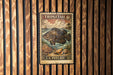 A vintage U.S. postage stamp featuring a large fish, placed on a wooden wall.