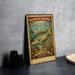 A vintage-style postage stamp featuring a yellowtail snapper fish, with a price of 10 cents, is displayed on a table.