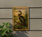 A vintage postage stamp featuring a large bird, likely a heron, perched on a branch. The stamp is mounted on a wall and is surrounded by greenery, including a plant.
