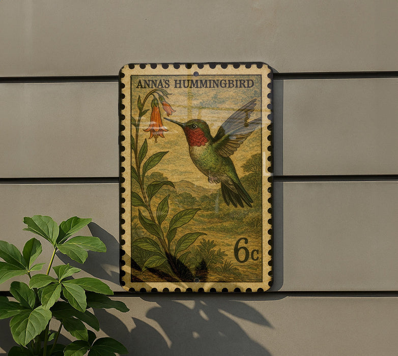 A postage stamp featuring a colorful illustration of a hummingbird perched on a flower, with the text "ANNAS HUMMINGBIRD" and the denomination "6c".