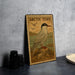 A metal sign with an illustration of an Arctic tern, a type of seabird, standing on a rock.