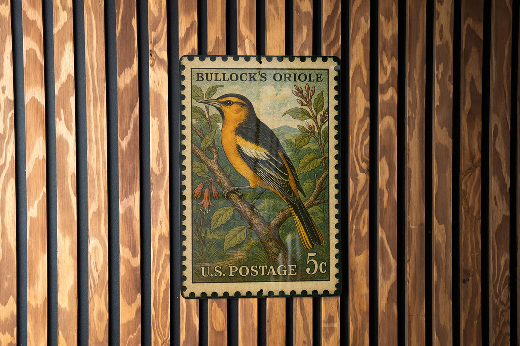 A vintage U.S. postage stamp featuring a colorful illustration of a bird perched on a branch, with the text "Bullock's Oriole" and "U.S. POSTAGE 5¢" printed on it.