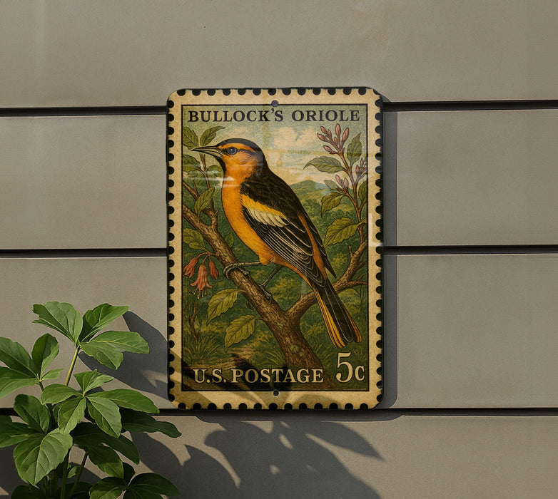 A vintage Bullock's Oriole postage stamp is displayed on a wall, featuring a detailed illustration of the bird perched on a branch.