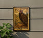 A postage stamp from the United States, featuring a large brown bird, likely a vulture, perched on a rock. The stamp is mounted on a wall, and there is a plant visible to the left of the stamp.