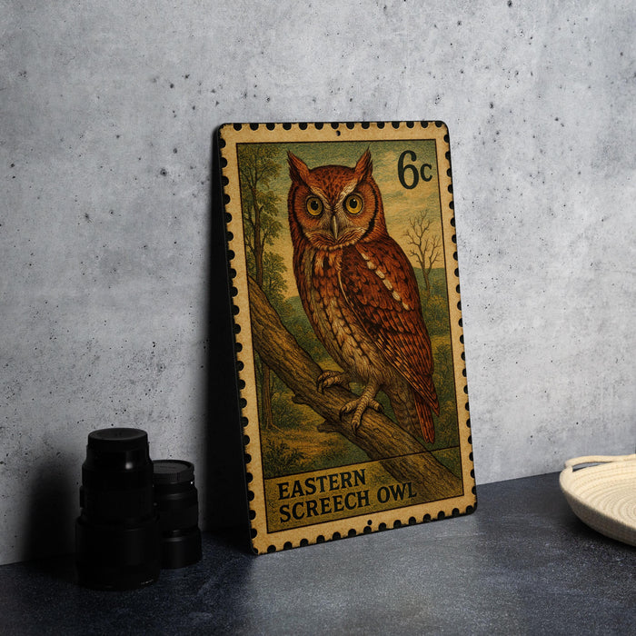 A metal stamp featuring an illustration of an Eastern Screech Owl, with the text "EASTERN SCREECH OYLE" printed on it.