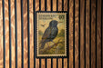 A postage stamp featuring a black bird perched on a branch, with the text "EUROPEAN STARLING" and the number "40" printed on it.