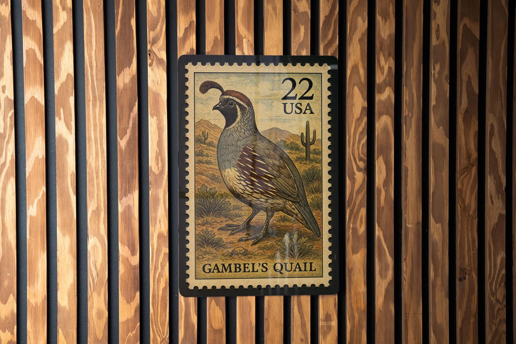 A 22-USA postage stamp featuring a quail bird is displayed on a wooden wall.