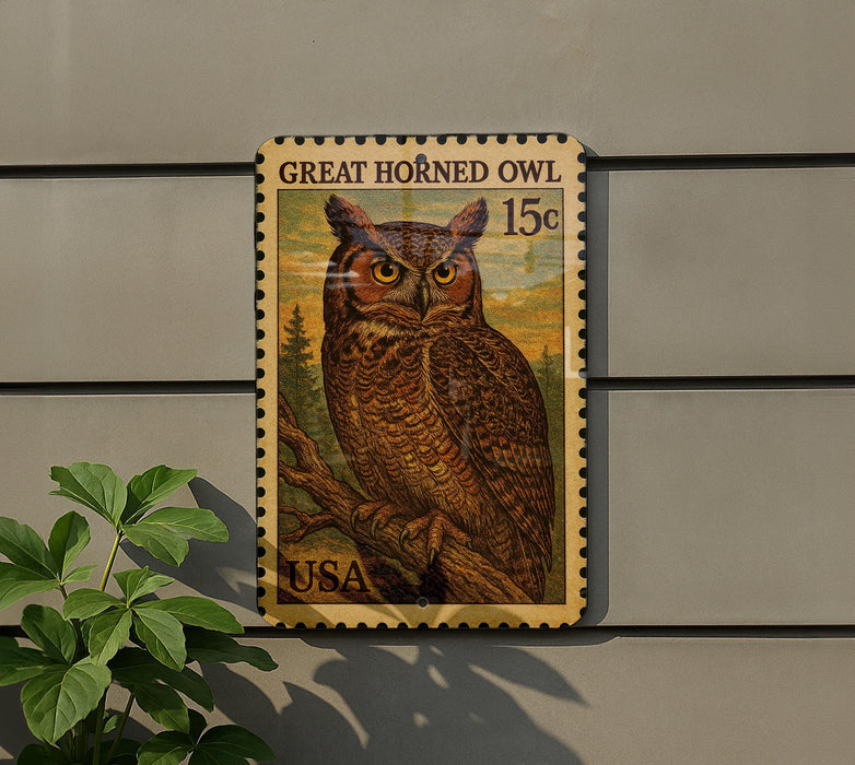 A postage stamp featuring a great horned owl, with the text "GREAT HORNED OWL 15¢" printed on it.