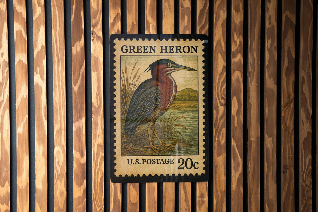 A postage stamp featuring a heron, with the text "GREEN HERON" and "U.S. POSTAGE 20¢" printed on it.