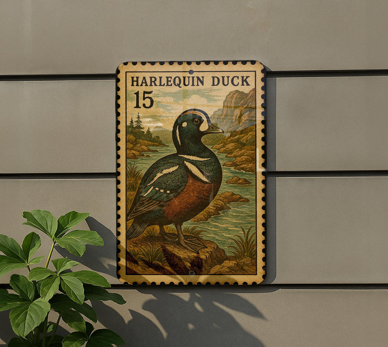 A postage stamp featuring a Harlequin duck, with the number 15 printed on it, is displayed on a wall.