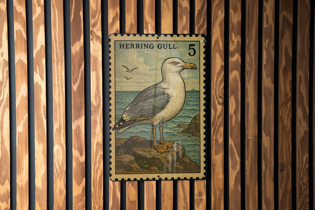 A postage stamp featuring a seagull standing on a rock, with a wooden background.