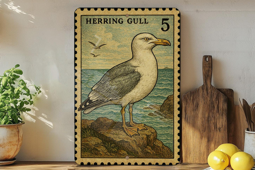 a framed illustration of a seagull, a type of bird, on a rock near the ocean. The seagull is depicted in a vintage style, with a postage stamp-like border. The seagull is standing on a rock, and there are some potted plants and a wooden cutting board visible in the background.