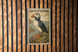 A framed illustration of a puffin bird is displayed on a wooden wall.