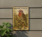 A vintage-style postage stamp featuring a colorful illustration of a House Finch perched on a branch, mounted on a wall next to a plant.