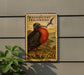 a postage stamp-like sign with a large, colorful bird illustration, mounted on a wall next to a plant.