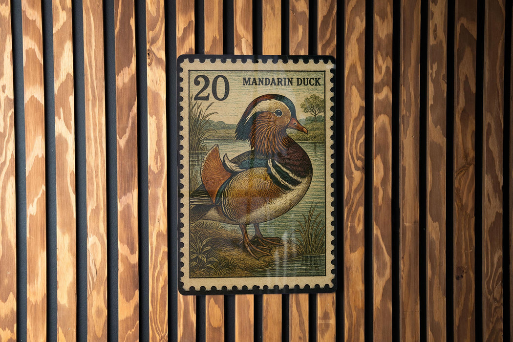 A postage stamp featuring a colorful illustration of a mandarin duck.
