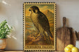 A framed illustration of a peregrine falcon is displayed on a shelf, surrounded by kitchen utensils and a potted plant.