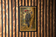 A postage stamp featuring a woodpecker is displayed on a wooden wall.