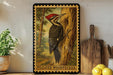 A framed illustration of a woodpecker is displayed on a shelf, surrounded by kitchen utensils and a potted plant.
