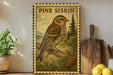 a wooden frame with a painting of a bird perched on a branch, surrounded by pine cones and pine trees, with the text "PINE SISKIN" above the bird.