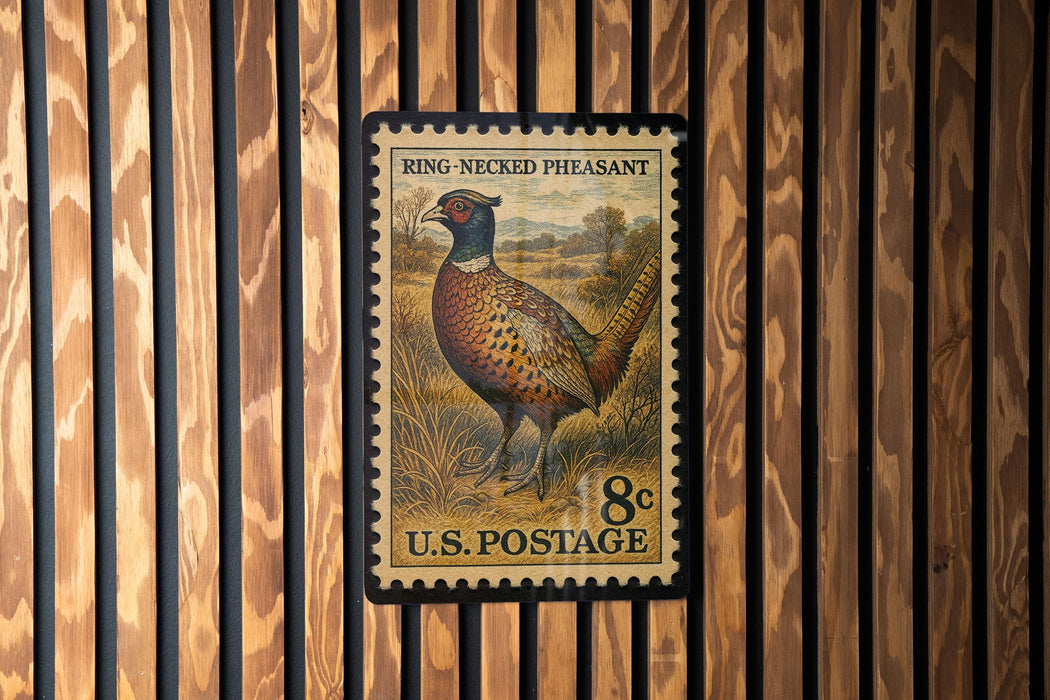 A U.S. postage stamp featuring a pheasant standing in a grassy field.