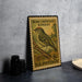 A vintage postage stamp featuring a small bird, likely a Ruby-Crowned Kinglet, perched on a branch.