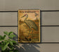 A U.S. postage stamp featuring a sandhill crane, mounted on a wall next to a plant.