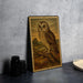 a framed painting of an owl perched on a branch, set against a natural landscape.
