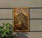 a framed painting of a white owl perched on a rock, set against a natural landscape.