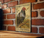 A vintage-style postage stamp featuring a turkey vulture is displayed on a brick wall.