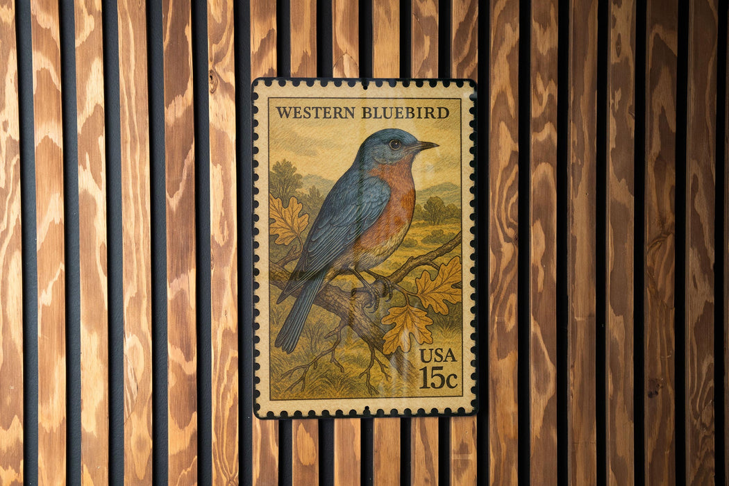 A U.S. postage stamp featuring a bluebird perched on a branch, with the text "WESTERN BLUEBIRD" and "15c" printed on it.