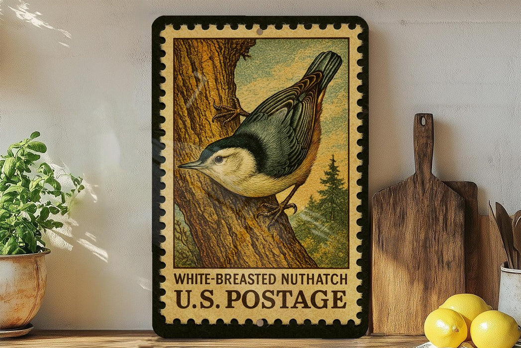 A framed vintage postage stamp depicting a white-breasted nuthatcher, a type of bird, is displayed on a shelf next to a wooden cutting board and some lemons.