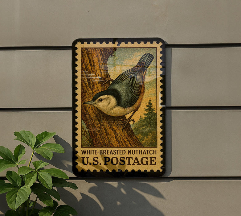 A postage stamp featuring a white-breasted nuthatch perched on a tree branch, with the text "WHITE-BREASTED NUTHATCH U.S. POSTAGE" printed on it.