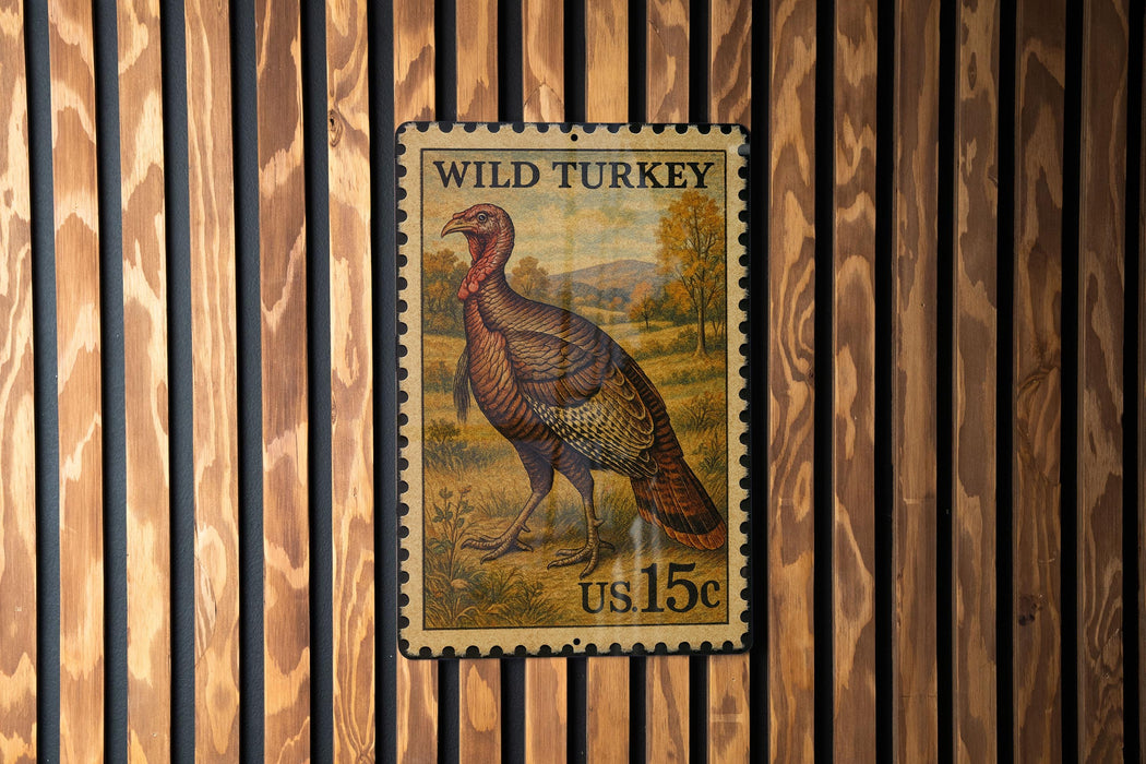 A vintage-style postage stamp featuring a turkey, mounted on a wooden wall.