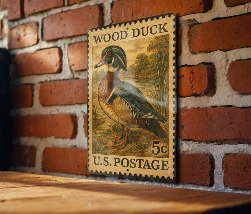A vintage-style postage stamp featuring a wood duck on a brick wall.