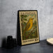 A U.S. postage stamp featuring a yellow warbler, with a 10-cent value, is displayed on a table.