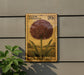 A wooden postcard with a large illustration of a flower, mounted on a wall.