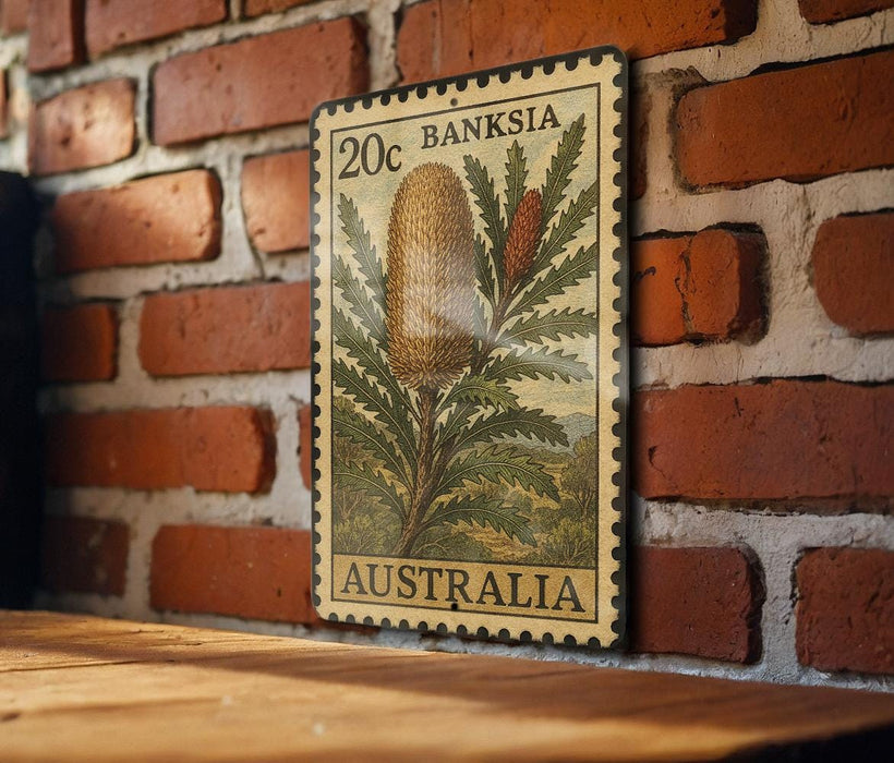 A 20c Australian postage stamp featuring a Banksia flower is displayed on a brick wall.